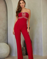 Luxe red jumpsuit with rhinestone bodice – strapless glam by Palazzo