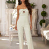 Elegant white jumpsuit with sparkling rhinestones and strapless cut