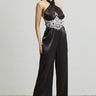 Elegant halter jumpsuit in black organza with golden waist embroidery