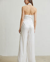 White halter jumpsuit with organza fabric and golden embroidery