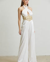 Front view of wide-leg white jumpsuit with rhinestone waist applique