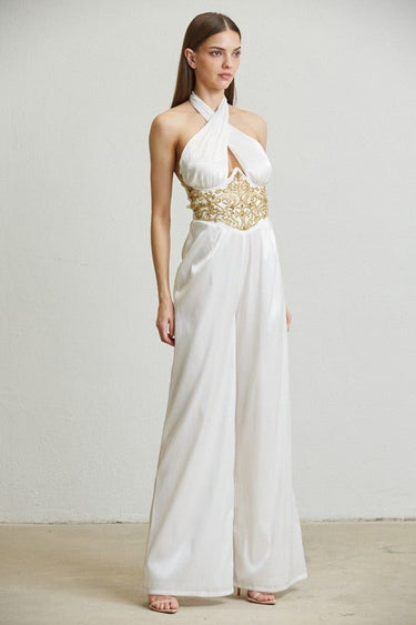 Front view of wide-leg white jumpsuit with rhinestone waist applique