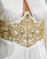 Back view of white embellished jumpsuit with invisible zipper