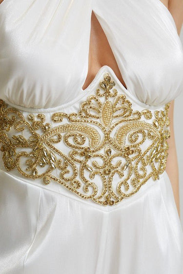 Back view of white embellished jumpsuit with invisible zipper