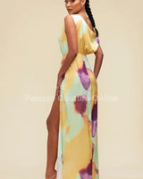 Elegant Orange/Mint one shoulder maxi dress on model styled for evening event