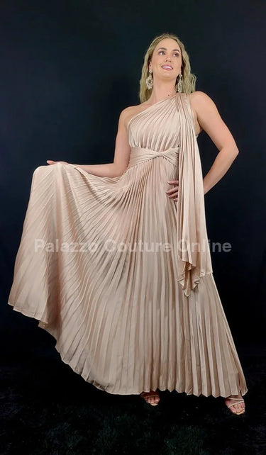 Elegant Champagne one shoulder maxi dress on model styled for evening event
