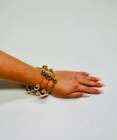 Orbital Flow Gold Cuff Bracelet with Sculptural Orbs - women's statement jewelry