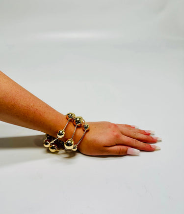 Orbital Flow Gold Cuff Bracelet with Sculptural Orbs - stylish accessory for every outfit