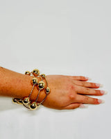 Orbital Flow Gold Cuff Bracelet with Sculptural Orbs for women - fashion jewelry by Palazzo Couture