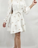 Elegant White shirt mini dress on model styled for going out