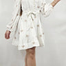 Elegant White shirt mini dress on model styled for going out