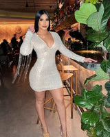 Elegant Silver sequin mini dress on model styled for going out