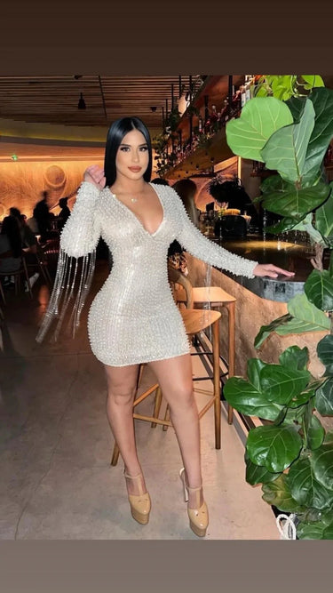 Elegant Silver sequin mini dress on model styled for going out