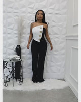 Women’s formal jumpsuit featuring a high waist and wide legs.
