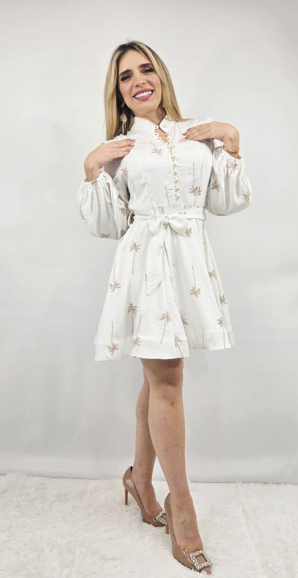 White mini dress with long puff sleeves, a collared neckline, and a belted waist featuring palm tree embroidery.