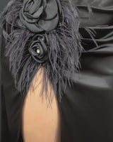 Elegant floral appliqué black top with sheer sleeves and matching satin skirt with high slit, perfect for formal evenings