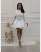 High-neck lace dress with organza balloon skirt for special occasions.
