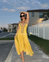 Elegant Yellow elegant maxi dress on model styled for evening event
