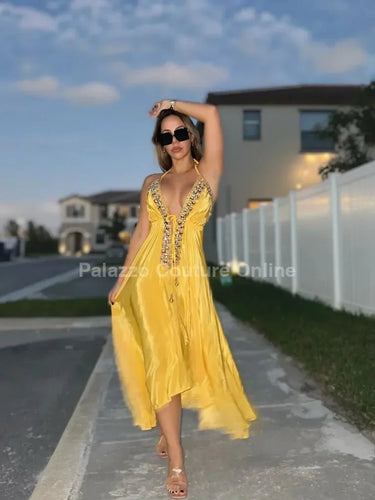 Elegant Yellow elegant maxi dress on model styled for evening event
