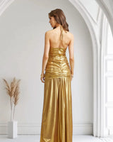 Elegant Gold metallic maxi dress on model styled for evening event