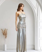 Elegant Silver metallic maxi dress on model styled for evening event