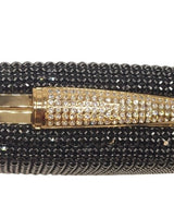 Luxury evening clutch with black and gold accents
