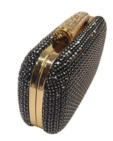 Black crystal clutch with gold metallic frame and clasp