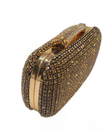 Gold crystal clutch with metallic frame and radiant shine
