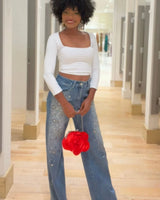 Radiant Pearl Embellished Wide-Leg Jeans close up of stylish fabric and construction detail