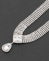 Rhinestone necklace set with teardrop pendant and silver finish