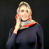 red derby style satin scarf with equestrian print flat lay