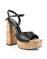 Lace-up ankle strap on black wedge heels