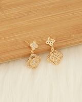 Rhinestone pavé clover-inspired drop earrings in gold-tone metal