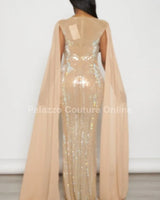 Elegant Nude cape maxi dress on model styled for evening event
