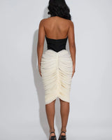 Elegant  high neck midi dress on model styled for evening