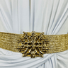 Gold statement belt with wide metallic band and ornate buckle