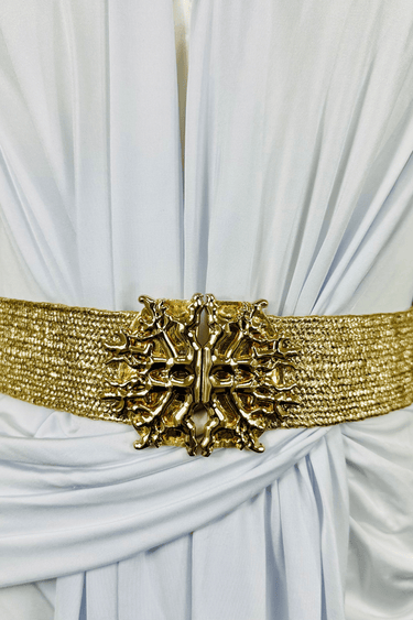 Gold statement belt with wide metallic band and ornate buckle