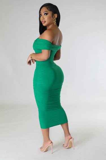 Elegant Green ruched midi dress on model styled for evening