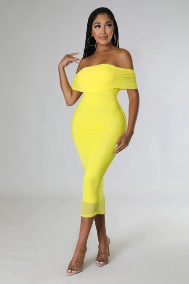 Elegant Yellow ruched midi dress on model styled for evening