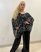 Splendida Silky Italian Black Blouse showing sleeve construction and neckline detail