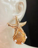 Dive deep into ocean-inspired elegance with these gold-plated starfish and pearl statement earrings.