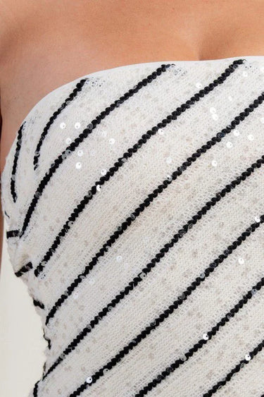 Starlight midi dress side view highlighting sequin stripe pattern and slit