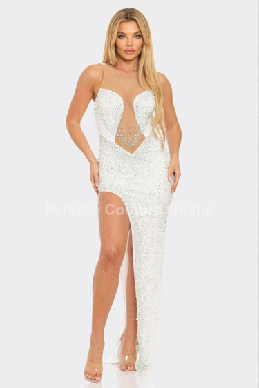 White sequin gown with rhinestone and pearl cutout detail