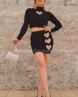 Black crop top and mini skirt co-ord with gold buttons