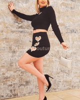 Stylish black two-piece set with long sleeves and fitted skirt – fashion outfit