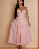 Shop our Sweetheart Corset Midi Dress in Pink for a flirty and feminine look that's perfect for any occasion.