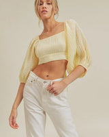 Textured Woven Open Back Blouse close up of elegant fabric and sleeve detail