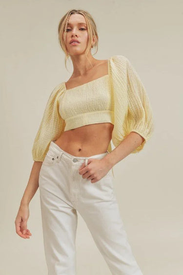 Textured Woven Open Back Blouse close up of elegant fabric and sleeve detail