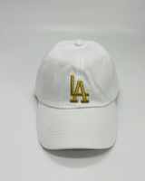 White baseball cap front view featuring gold embroidery