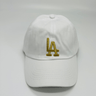 White baseball cap front view featuring gold embroidery